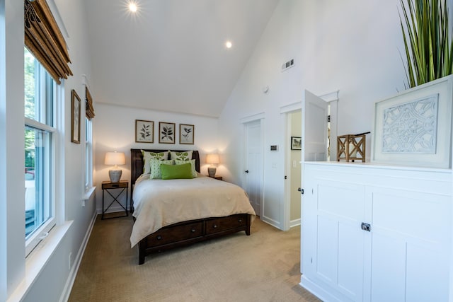 7881 Lakewood Dr, Coloma, MI 49038 - bedroom featuring high vaulted ceiling, light carpet, and baseboards