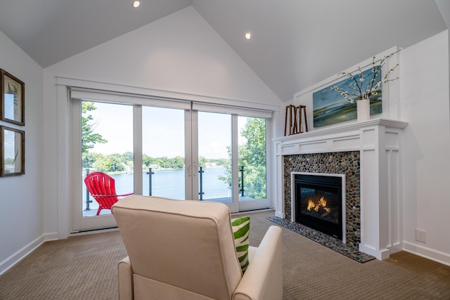 7881 Lakewood Dr, Coloma, MI 49038 - living room featuring carpet flooring, a water view, a tiled fireplace, high vaulted ceiling, and recessed lighting