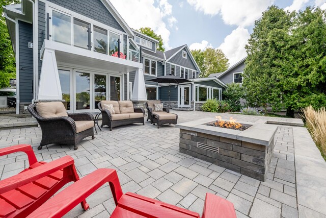 7881 Lakewood Dr, Coloma, MI 49038 - view of patio with french doors and an outdoor living space with a fire pit