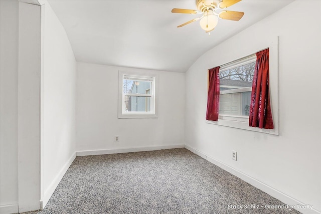 unfurnished room featuring baseboards, carpet floors, a ceiling fan, and a healthy amount of sunlight