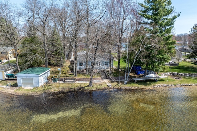 8581 Lynwood Ln, Mecosta, MI 49332 - exterior space featuring a detached garage, a water view, and an outbuilding