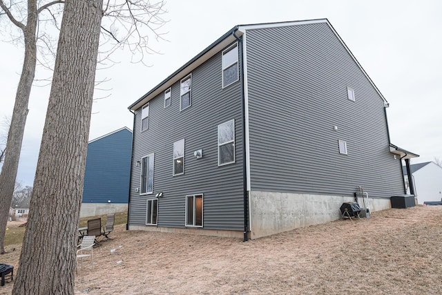 view of property exterior with central AC