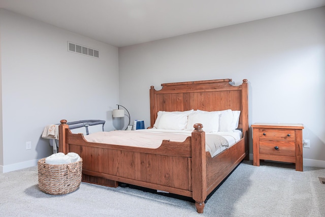 bedroom featuring carpet, visible vents, and baseboards