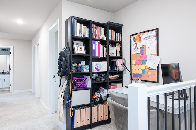 interior space with carpet floors and baseboards