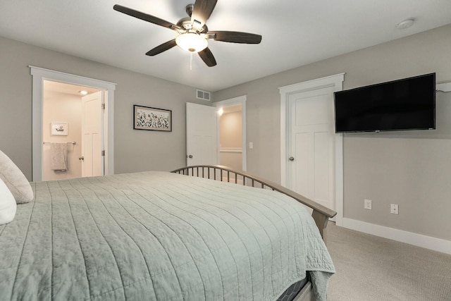 bedroom with baseboards, visible vents, ceiling fan, ensuite bathroom, and carpet floors