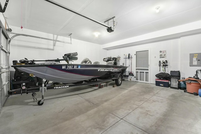 garage with electric panel and a garage door opener