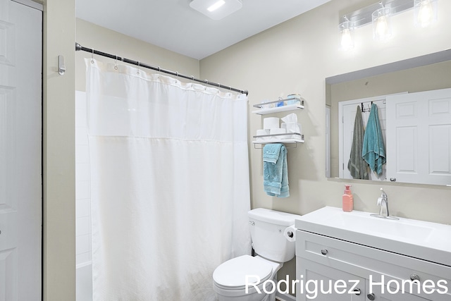 full bathroom with vanity and toilet