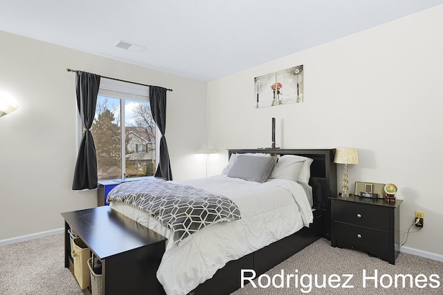 bedroom featuring visible vents, baseboards, and carpet flooring