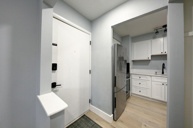 bathroom featuring wood finished floors and vanity