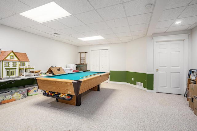 rec room featuring baseboards, visible vents, a drop ceiling, and carpet flooring