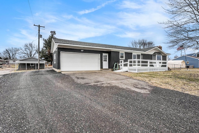 view of front of house with a garage and aphalt driveway