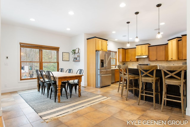 dining room featuring recessed lighting and baseboards