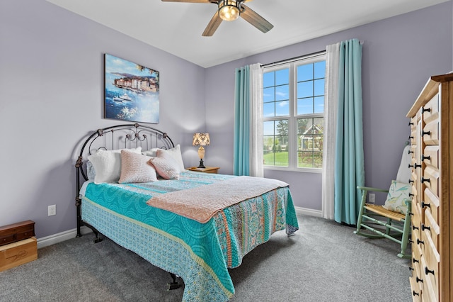 carpeted bedroom featuring ceiling fan and baseboards