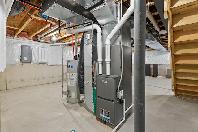 utility room featuring gas water heater, electric panel, and heating unit