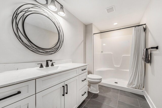 bathroom with visible vents, toilet, tile patterned flooring, vanity, and a shower stall