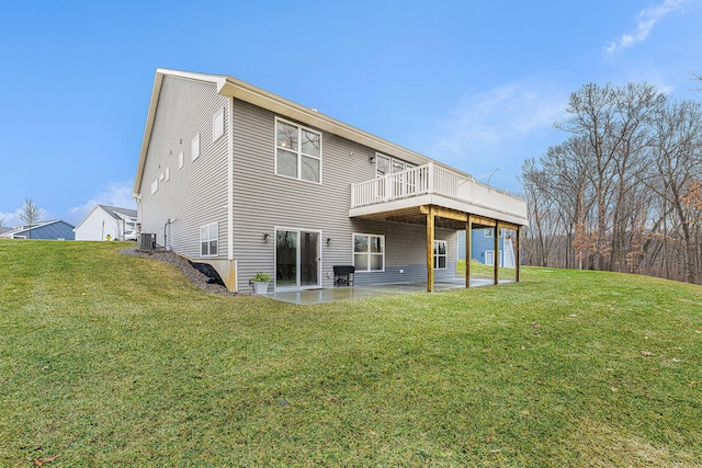 back of property with a yard, central AC, a patio, and a deck