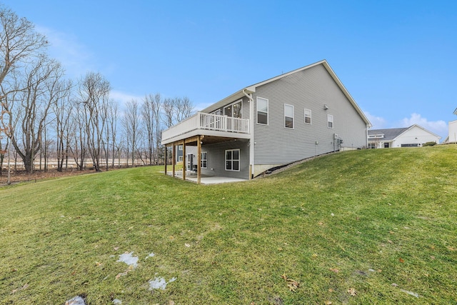 exterior space with a patio area, a wooden deck, and a yard