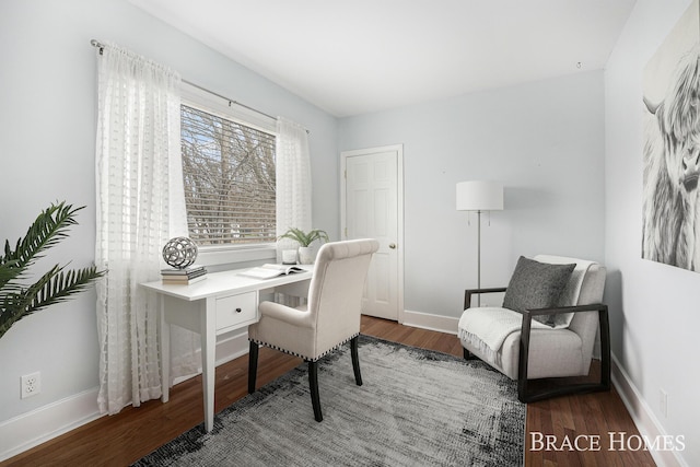 office area with baseboards and wood finished floors