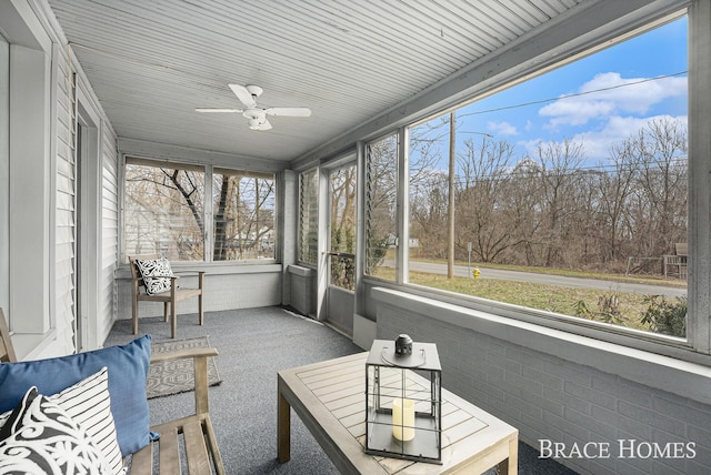 sunroom / solarium with ceiling fan