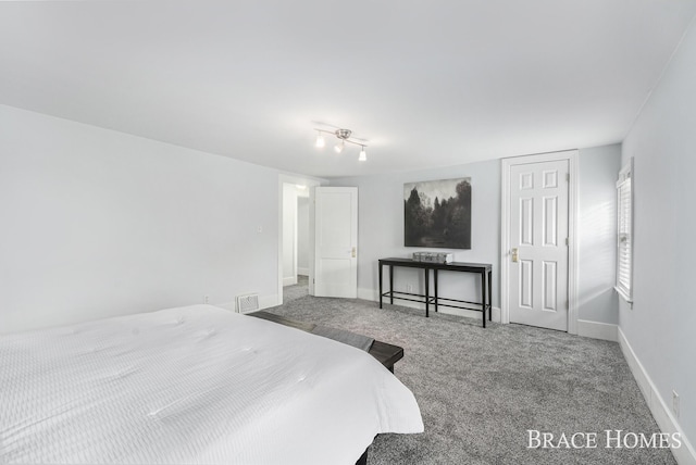 bedroom featuring carpet, visible vents, and baseboards