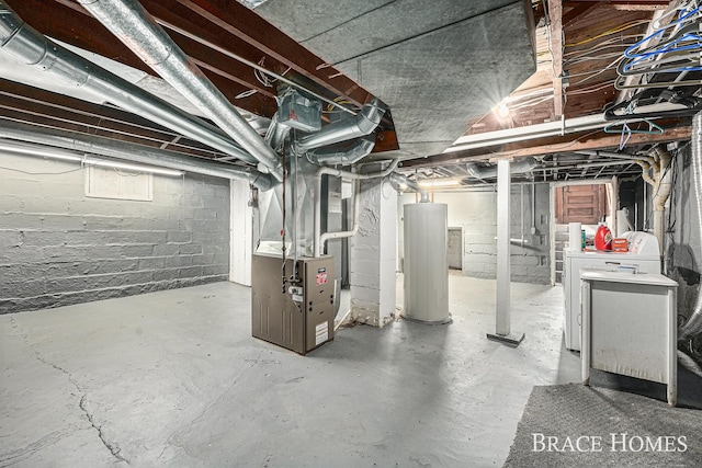 unfinished basement with heating unit, separate washer and dryer, and gas water heater