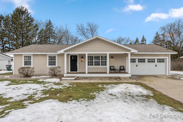 view of front of home with an attached garage, covered porch, a shingled roof, and concrete driveway