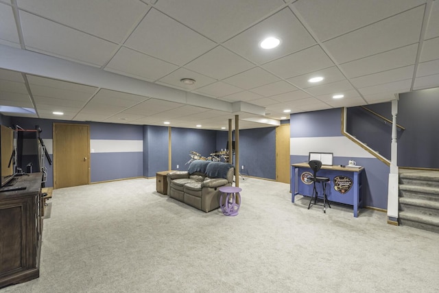 carpeted living room with a paneled ceiling, stairway, and recessed lighting