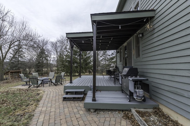 wooden deck with a fire pit