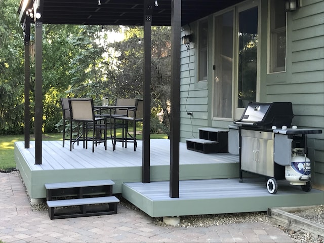 deck with outdoor dining area