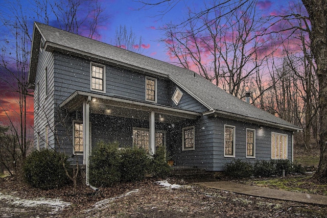 view of front of house featuring roof with shingles