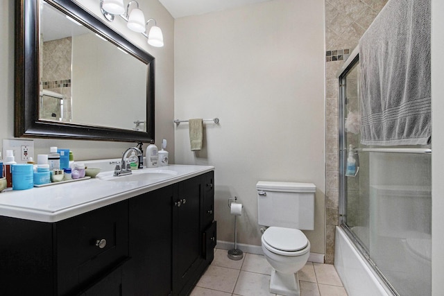 full bath featuring baseboards, toilet, shower / bath combination with glass door, tile patterned floors, and vanity