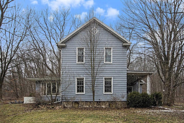 view of home's exterior featuring a lawn