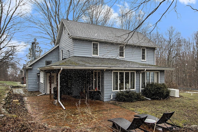 exterior space with a shingled roof