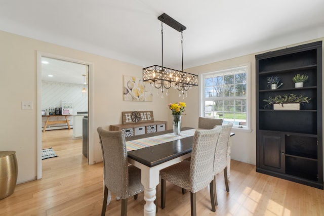 dining room featuring a chandelier and light wood-style floors