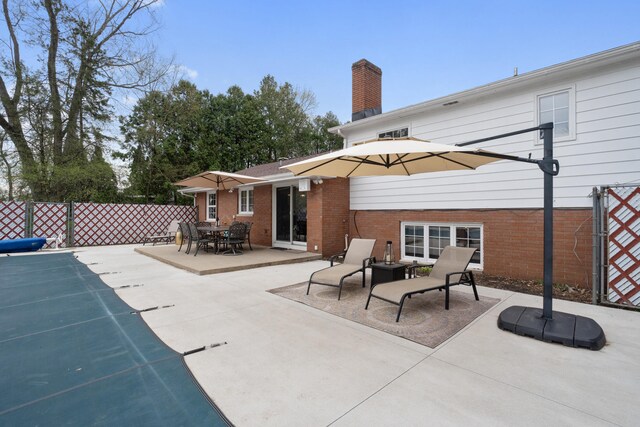 view of patio / terrace featuring fence
