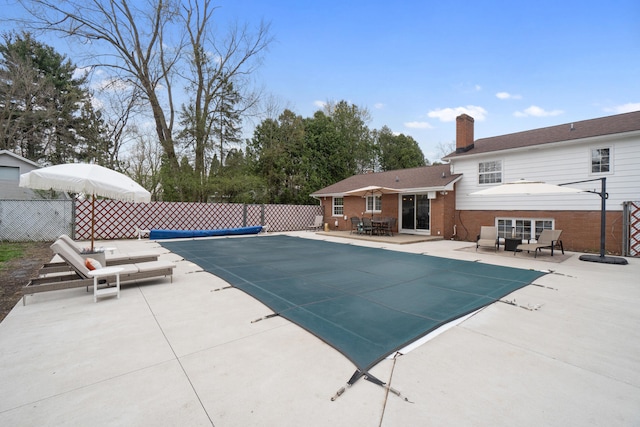 view of swimming pool with fence, a patio, and a fenced in pool