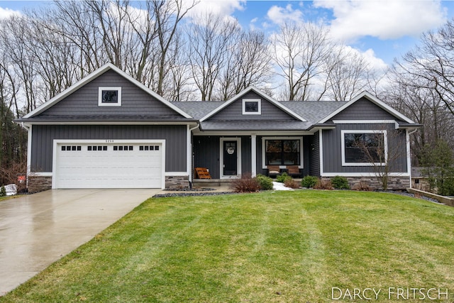 craftsman inspired home with a porch, concrete driveway, board and batten siding, a garage, and a front lawn