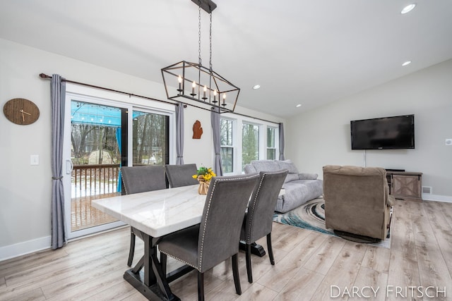 dining space featuring light wood-style floors, lofted ceiling, baseboards, and recessed lighting