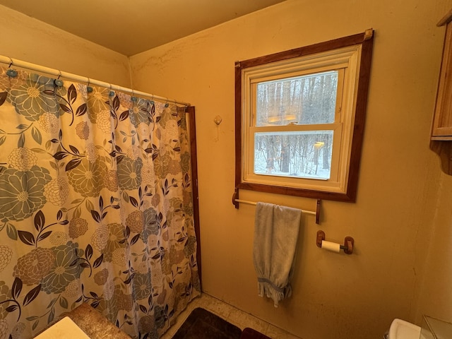 bathroom with a shower with curtain