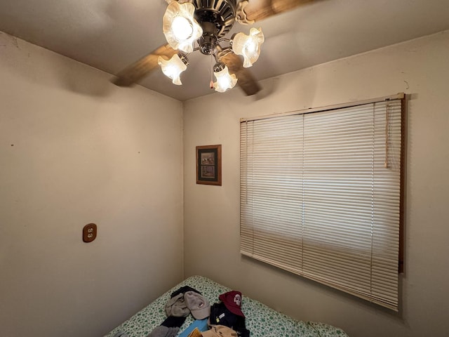 unfurnished bedroom featuring a ceiling fan