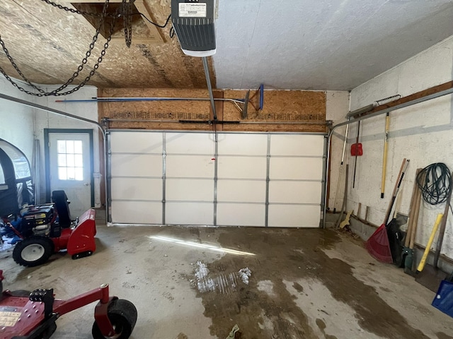 garage featuring a garage door opener