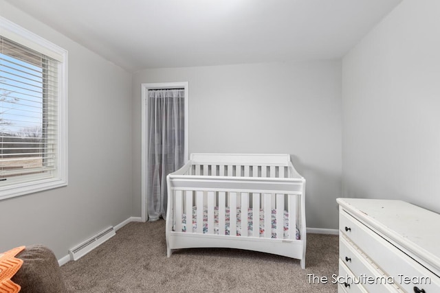 bedroom with carpet floors, a baseboard radiator, multiple windows, and a crib