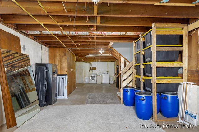 unfinished basement featuring washer and dryer