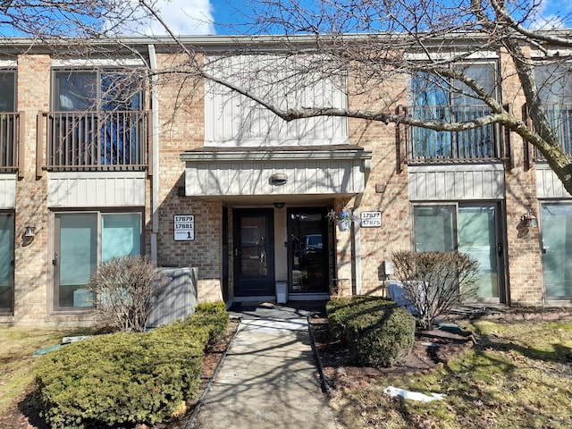 entrance to property with brick siding