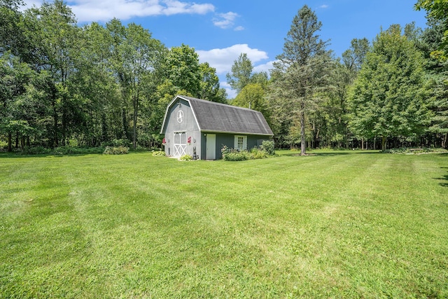 view of yard with an outdoor structure and a barn