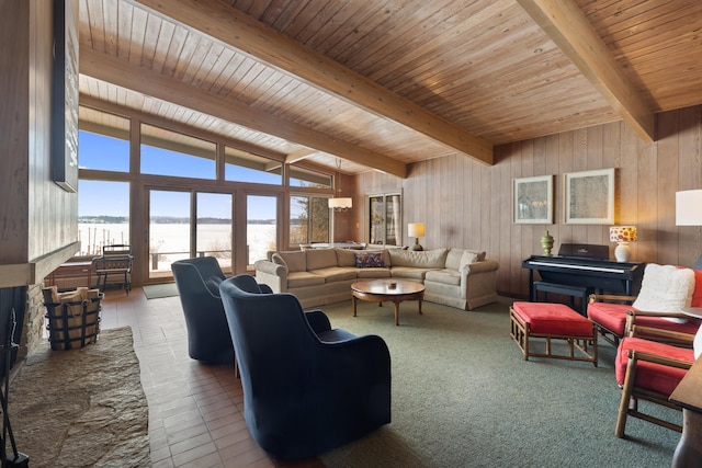 living area with wooden walls, a fireplace, wood ceiling, tile patterned floors, and beamed ceiling