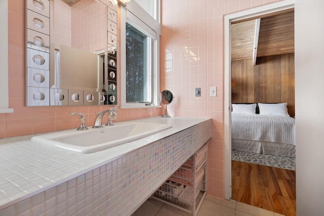 bathroom featuring vanity, tile walls, and tile patterned floors