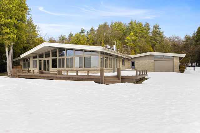 mid-century home featuring a sunroom