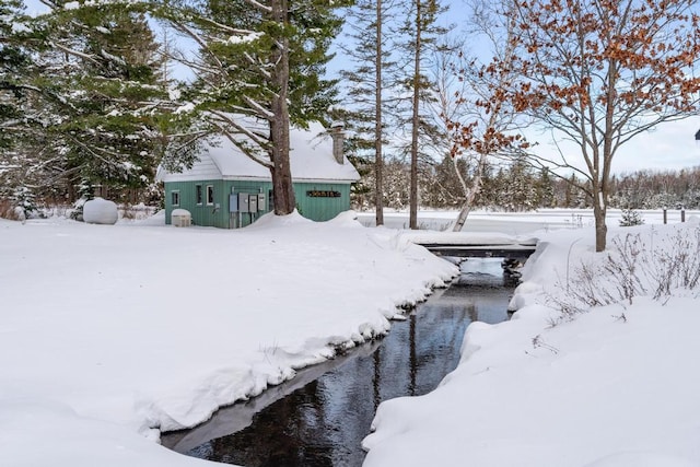 view of yard covered in snow