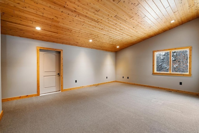 empty room featuring wooden ceiling, recessed lighting, carpet flooring, baseboards, and vaulted ceiling